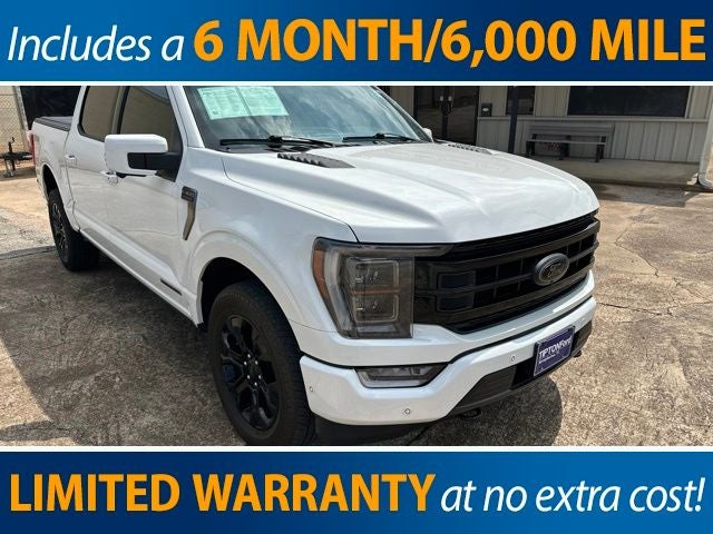 2023 Ford F-150 Platinum in Star White Metallic Tri-Coat — front three-quarter view