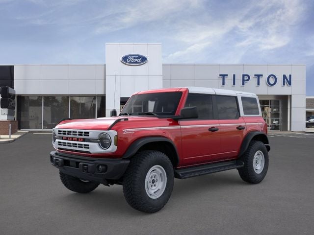 2026 Ford Bronco Heritage Edition in Ruby Red Metallic Tinted Clearcoat — front three-quarter view